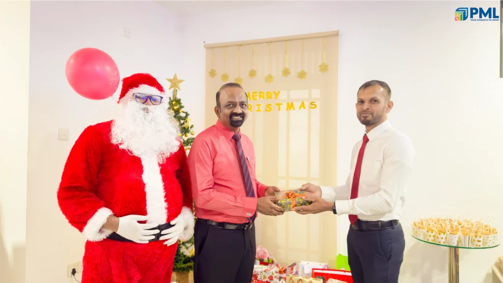 Employees receiving gifts from Santa in office 42