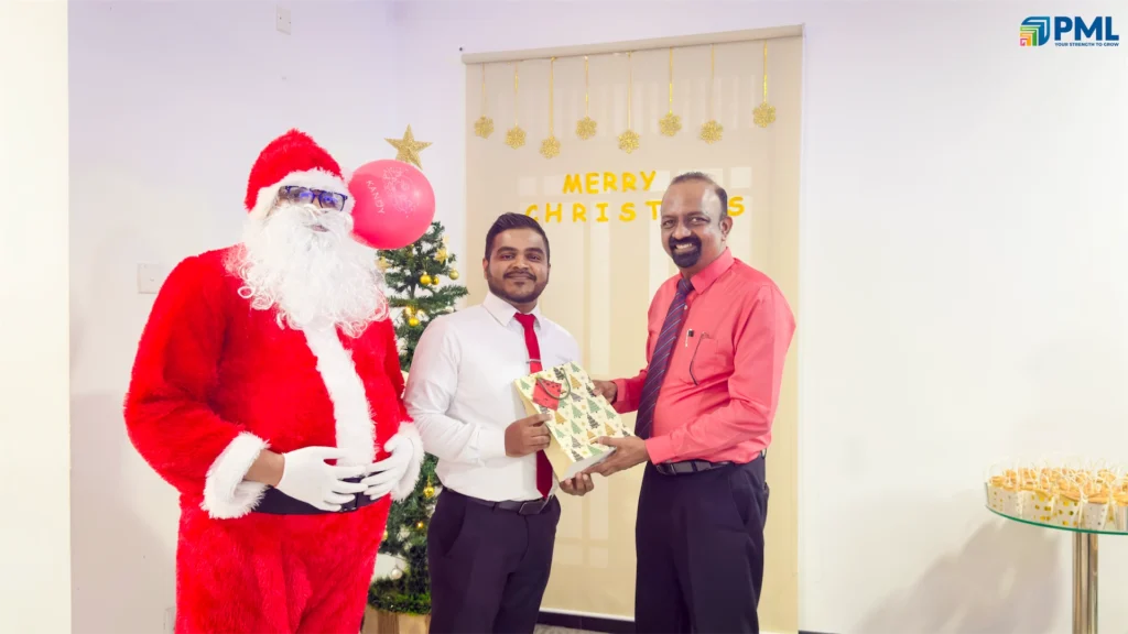 Employees receiving gifts from Santa in office 41