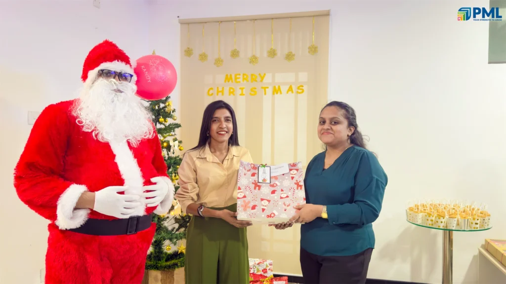 Employees receiving gifts from Santa in office 2