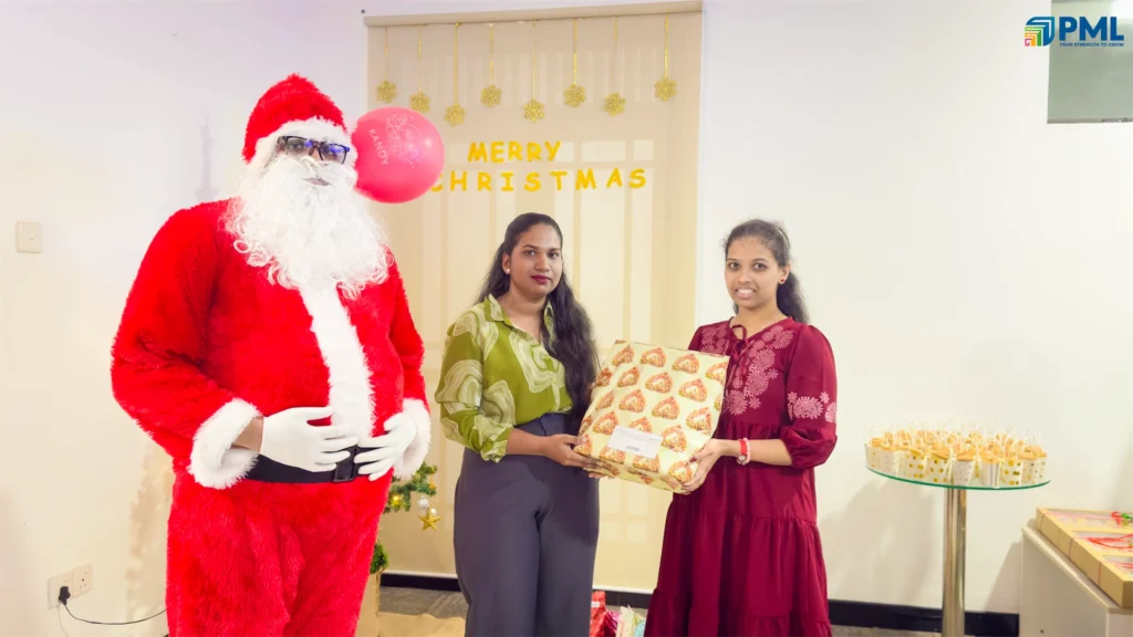 Employees receiving gifts from Santa in office 1